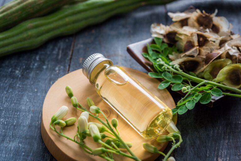 Glass bottle of moringa oil